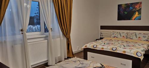 Ένα ή περισσότερα κρεβάτια σε δωμάτιο στο Apartament Atena