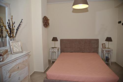 Postel nebo postele na pokoji v ubytování ΜΕΖΟΝΕΤΑ 120 τ.μ.