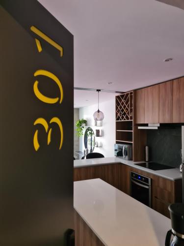 a kitchen with a yellow sign that reads mcdonalds at Acogedor y moderno departamento in Mexico City