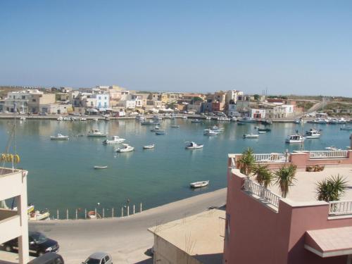 a view of a harbor with boats in the water at Bivani sul porto vecchio in Lampedusa