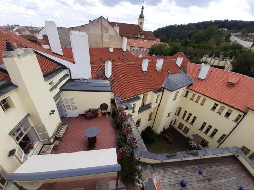 an overhead view of a building with red roofs at At the Blue Lion & Parking Assistance in Prague