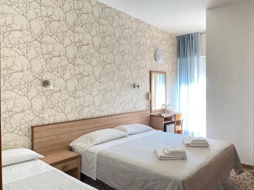 Postel nebo postele na pokoji v ubytování Hotel Ravello Adults Only