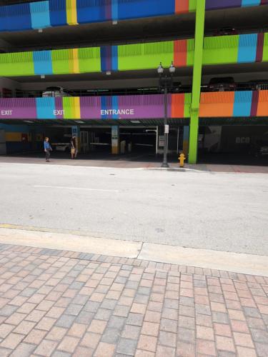 an empty street in front of a colorful building at Amazing Condo in Downtown Miami/Brickell w/PARKING in Miami