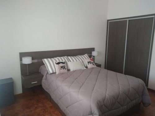 Una cama o camas en una habitación de Casa zona Punta Mogotes