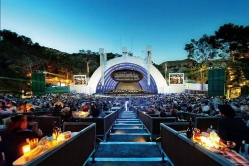 a crowd of people sitting at tables in front of a stage at Franklin Loft Walk to Hollywood Bowl in Los Angeles