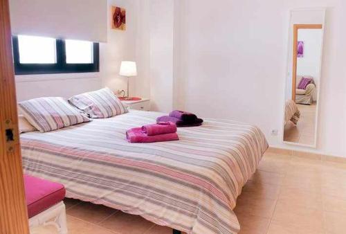 Ένα ή περισσότερα κρεβάτια σε δωμάτιο στο Enjoy Arrecife Center