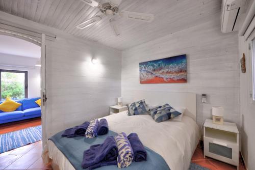 a bedroom with a large bed with two pillows at The Secret Corner of Luz in Luz