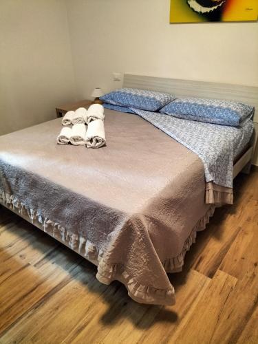 a bed with two pillows on top of it at L'incanto home in Bologna