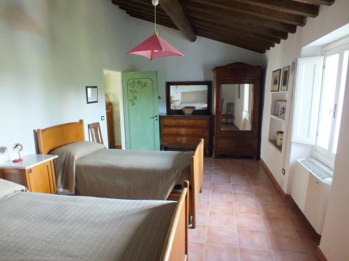 Ένα ή περισσότερα κρεβάτια σε δωμάτιο στο Agriturismo Ai Mandrioli