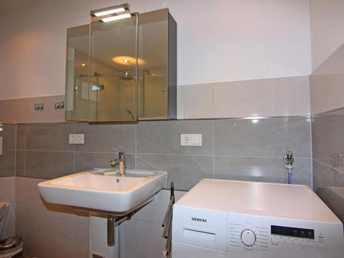 a bathroom with a sink and a mirror at Holiday Home Sturmeck, Fehmarn-Orth in Orth