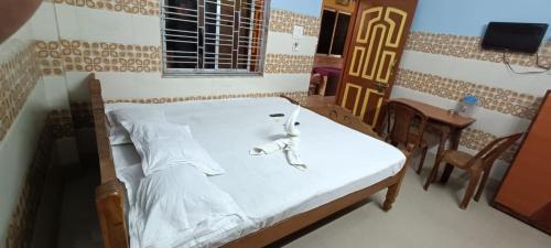 Katil atau katil-katil dalam bilik di Goroomgo Chemistrica Digha