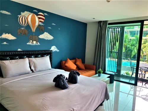 Ένα ή περισσότερα κρεβάτια σε δωμάτιο στο Pixel Condo - Panwa Beach