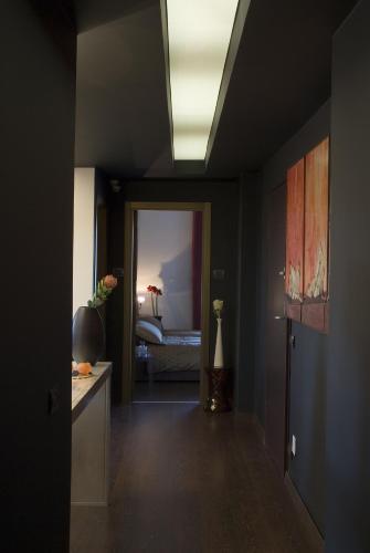 a hallway with a room with a bed in the background at Eh13 Luxury Accommodation in Catania