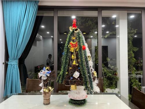 a christmas tree sitting on top of a table at Friendly villa SH Đại Lải 4 phòng ngủ in Phúc Yên