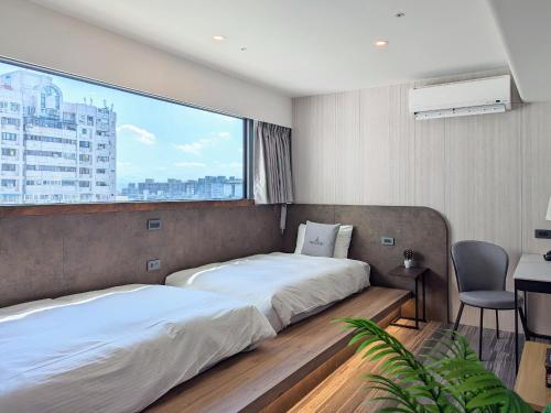 Postel nebo postele na pokoji v ubytování K Hotel - Yizhong