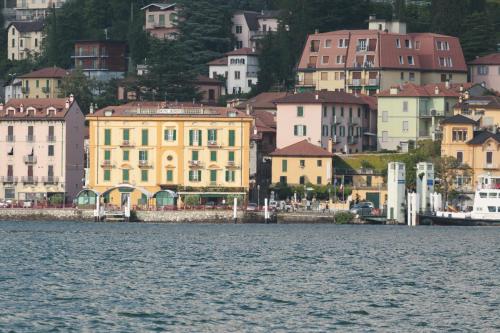 a view of a city from the water at Hotel Olivedo in Varenna