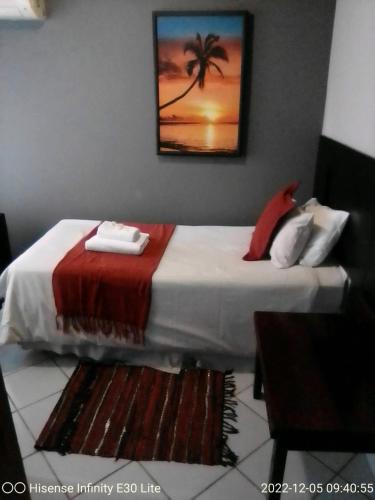 Cama ou camas em um quarto em Rustenburg Guesthouse