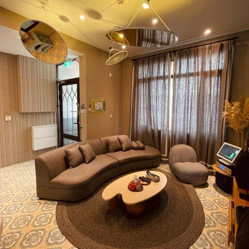 a living room with a couch and a coffee table at Akasaka Family Villa in Tainan