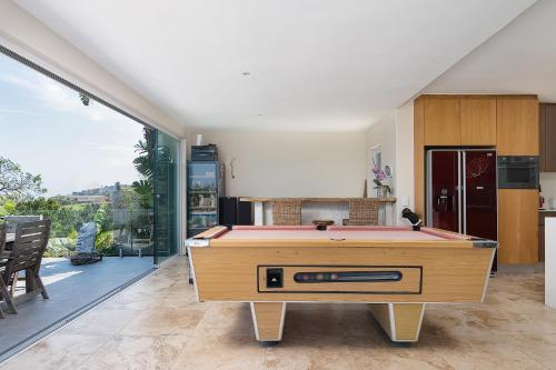 a living room with a pool table in it at Madeleine Drive in Ballito