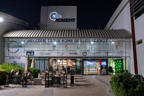 a welcome to the home of little target at night at Emirates Sports Hotel, Dubai Sports City in Dubai