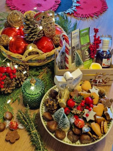 a table with a plate of food and christmas decorations at Beit Petra in Daratso