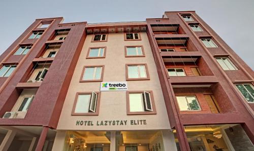 a tall building with a hotel library elite at Treebo Trend Lazystay Elite in Bhubaneshwar