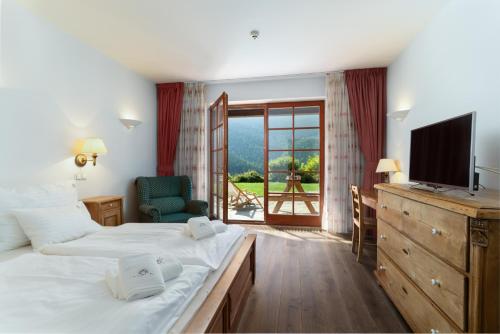 Postel nebo postele na pokoji v ubytování Pension Slunečnice & Panorama Restaurace Farma