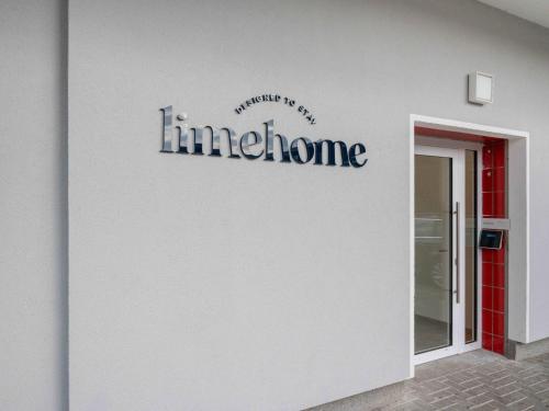 a sign on the side of a building at limehome Salzgitter A.-Schweitzer-Str. in Salzgitter