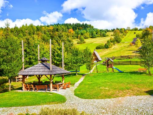 a picnic area with a gazebo and a playground at Gościniec Rabe - Agro&SPA in Ustrzyki Dolne