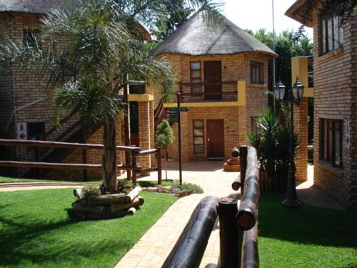 a wooden fence in front of a house at Goodnight Guest Lodge in Johannesburg