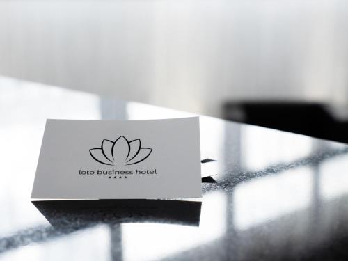a card sitting on top of a table at Loto Business Hotel in Rome