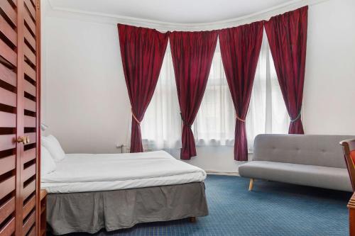 Un ou plusieurs lits dans un hébergement de l'établissement Best Western Tidbloms Hotel