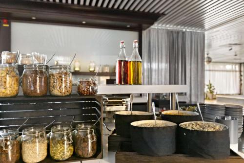 a kitchen with several jars of food on a counter at Best Western Hotel Scheele in Köping