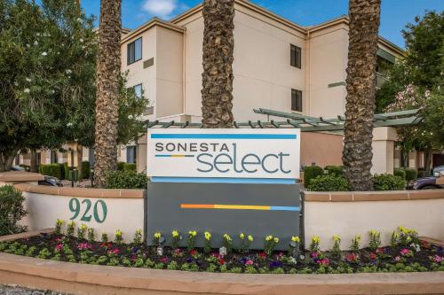 a sign for somerset select in front of a building at Sonesta Select Phoenix Chandler in Chandler