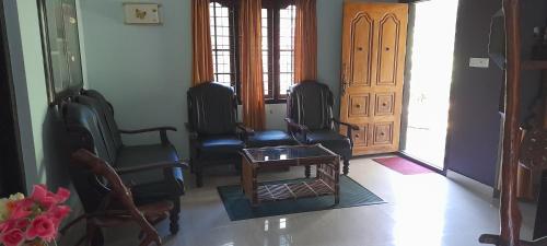 Zona de estar de Le Farmhouse Munnar