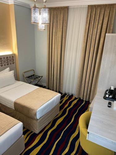 Ένα ή περισσότερα κρεβάτια σε δωμάτιο στο Dar Al Naem Hotel