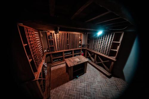 an overhead view of a room with a table in a wine cellar at Grand Opera Hotel in Kutaisi