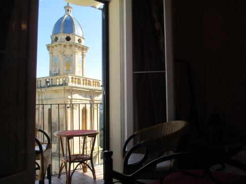 a view of a clock tower from a balcony at B&B Belvedere All'Idria in Ragusa