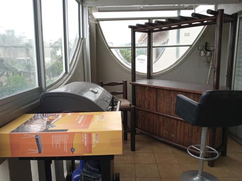 a room with a pizza box and a window at Wedgewood Terrace in Durban