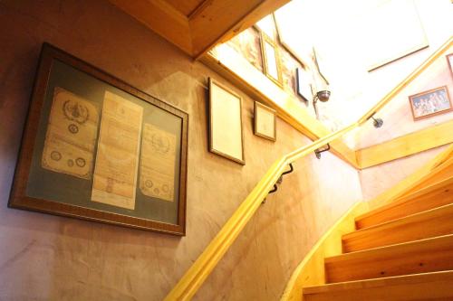 a set of stairs with a picture on the wall at Stone House with Garden in Cunda/Ayvalik in Ayvalık