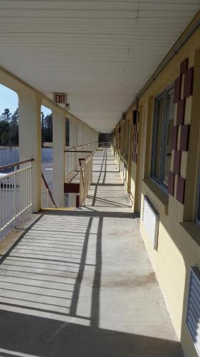 an empty hallway of a school building with a building sign on it at Economy Inn Dillon in Dillon