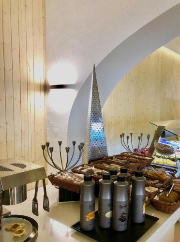 a kitchen with a counter with a table with food at Hotel Tagomago in San Antonio Bay