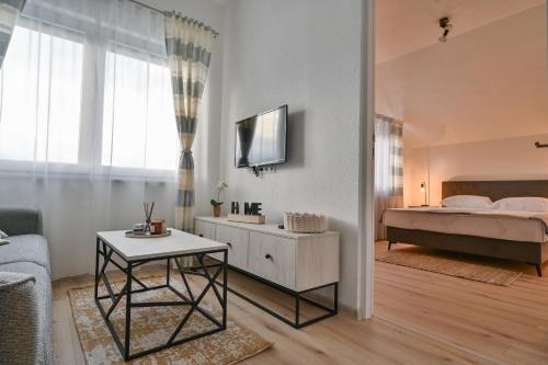 Postel nebo postele na pokoji v ubytování Apartman UMA