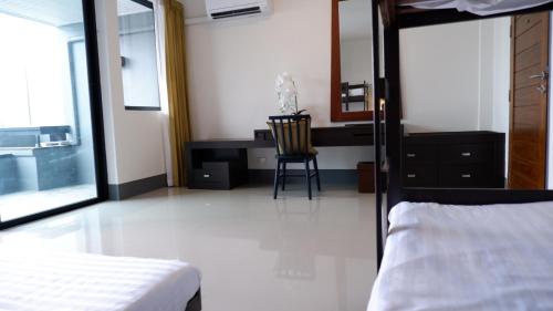 Ένα ή περισσότερα κρεβάτια σε δωμάτιο στο Nara Residence Trang
