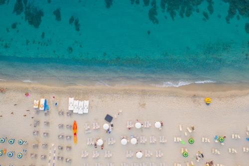 an overhead view of a beach with chairs and umbrellas at La Meridiana in Capo Vaticano