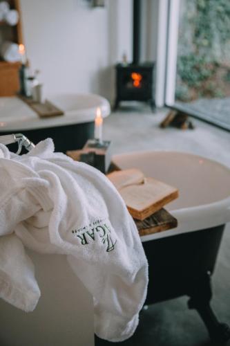 a bathroom with a white towel on a sink at TheVagar Countryhouse in Belmonte