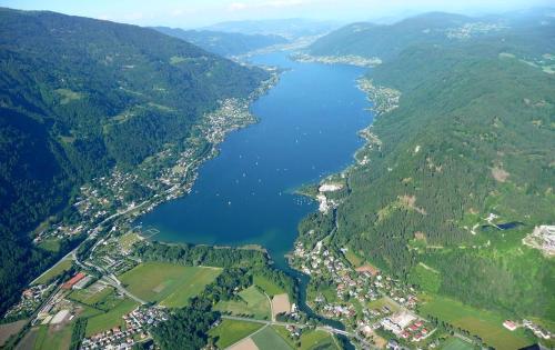 an aerial view of a lake in a valley at Apartment Deluxe Ossiacher See - Gerlitzen in Sattendorf