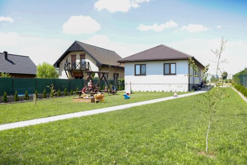 a house with a playground in a yard at Bingo in Powidz