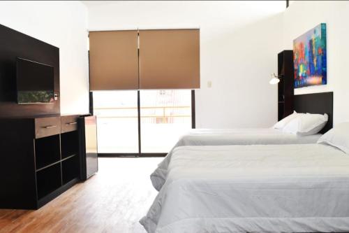 Cama o camas de una habitación en Casa Taller Ramirez