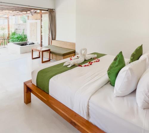 Ліжко або ліжка в номері Villa Salaska by Bali Prime Hospitality
